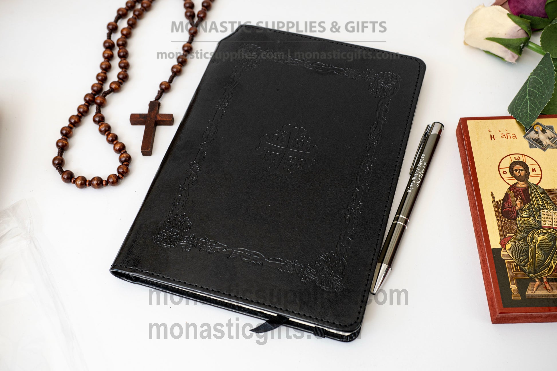Orthodox embossed leather notebook set featuring an elastic band closure, ribbon bookmark, hidden back compartment, and a luxury Jesus Prayer inscribed pen.