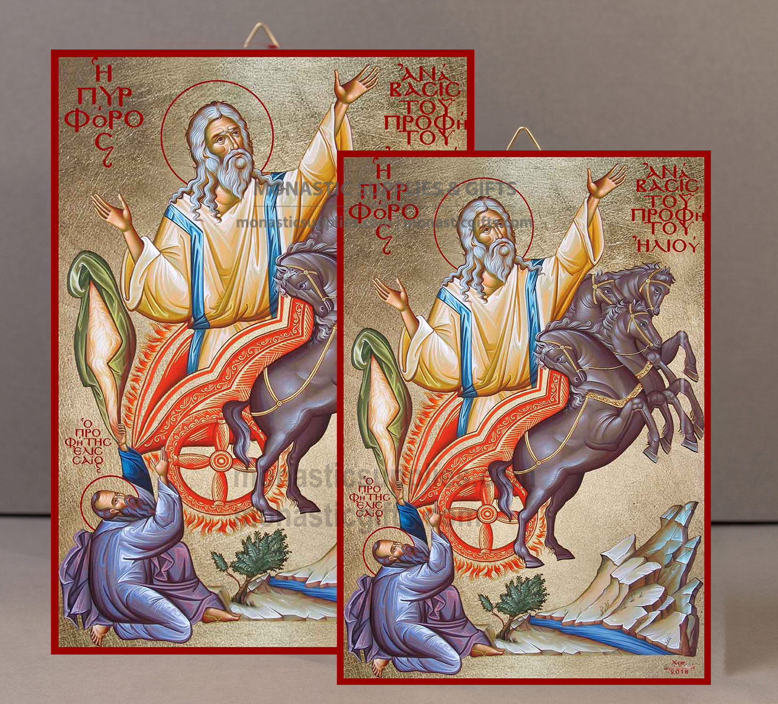 Two framed religious icon paintings of Saint Paul riding a dark horse, shown overlapping against a neutral gray background. The icons feature gold backgrounds, red borders, and detailed figures with Greek text.