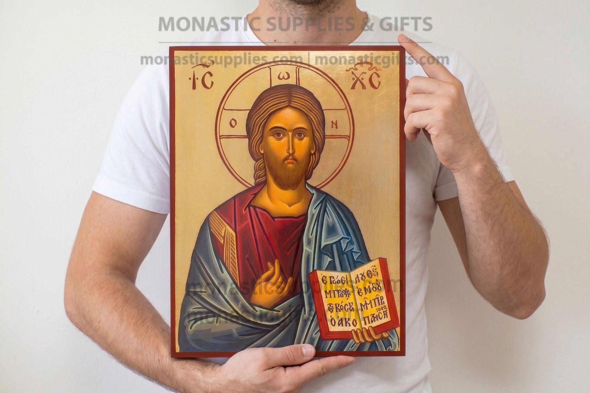 Authentic large 30x40cm (11.81x15.75in) Byzantine gold leaf icon of Christ Blessing on a solid wood plaque held by a person.