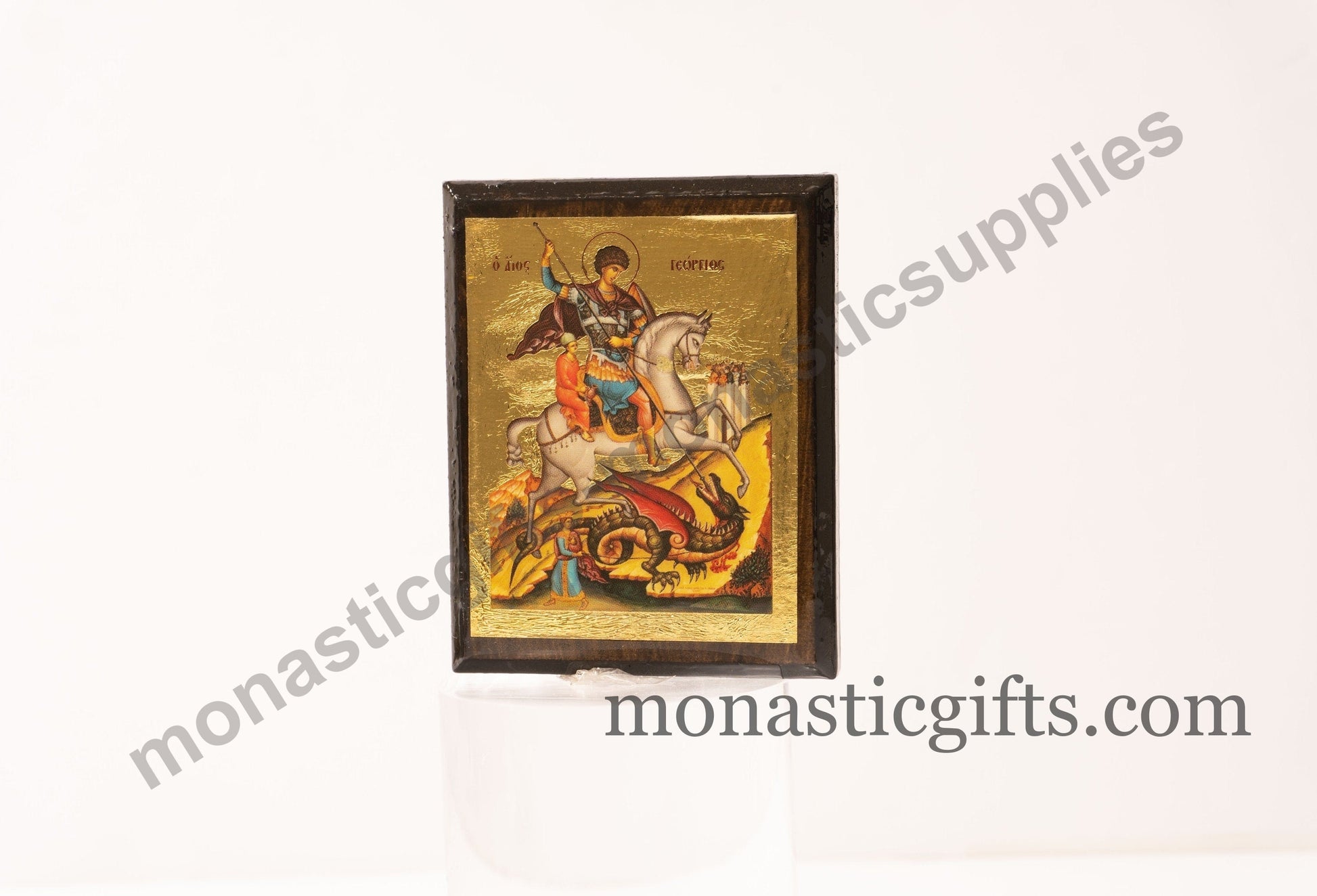 Handmade wooden Byzantine Orthodox icon refrigerator magnet of Saint George slaying the dragon.