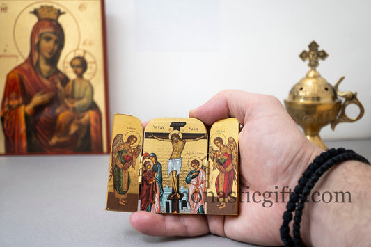 Handcrafted small wooden folding triptych Orthodox icon of the Crucifixion of Jesus Christ with angels for home iconostasis