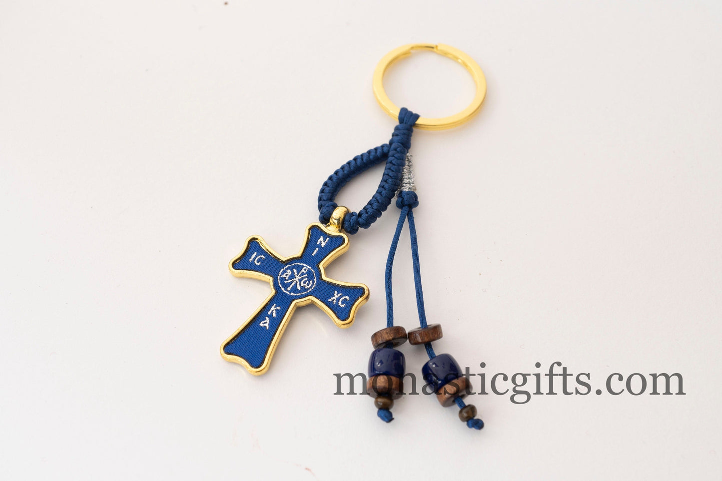 Christian keychain in the shape of a cross , embroidered fabric with the symbols of Jesus Christ in blue color ,a perfect Religious Gift .