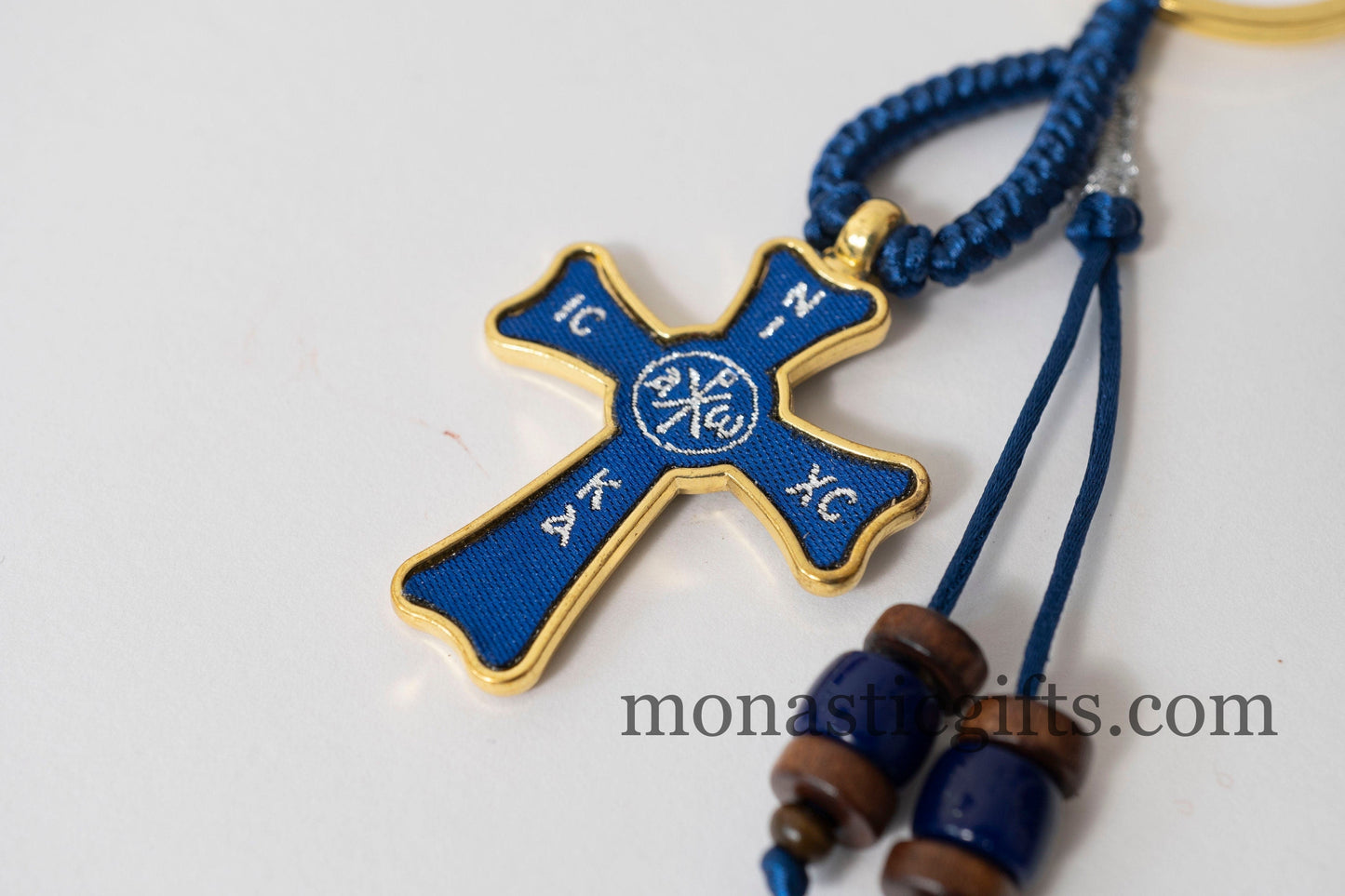 Christian keychain in the shape of a cross , embroidered fabric with the symbols of Jesus Christ in blue color ,a perfect Religious Gift .