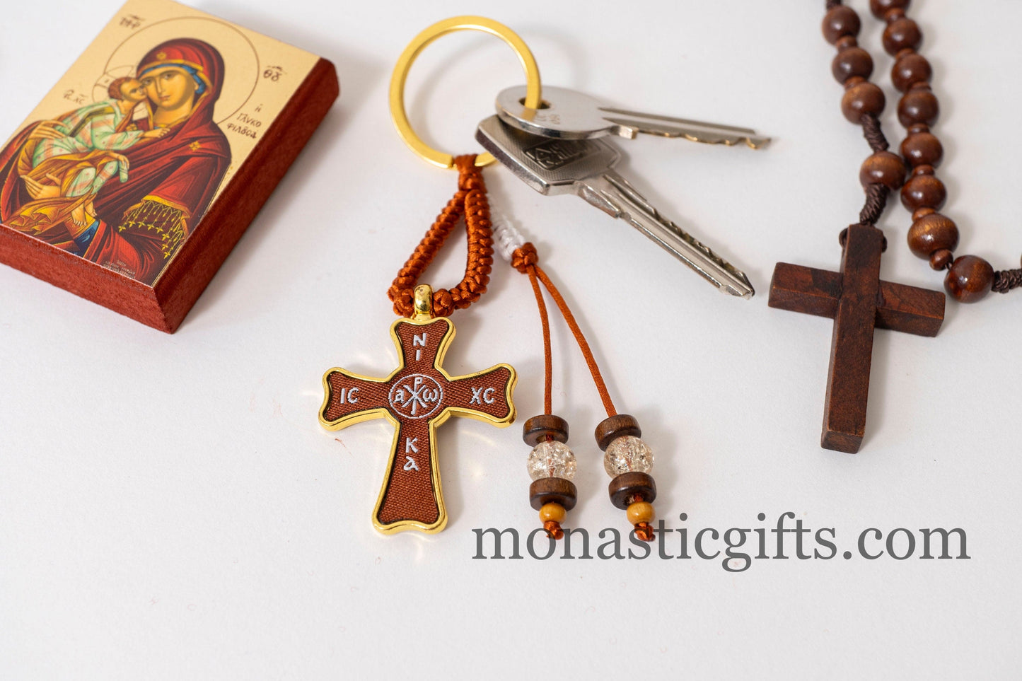 Christian keychain in the shape of a cross , embroidered fabric with the symbols of Jesus Christ ,a perfect Religious Gift .