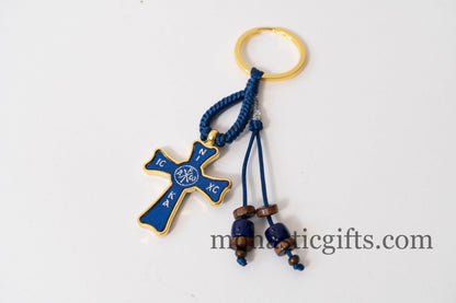 Christian keychain in the shape of a cross , embroidered fabric with the symbols of Jesus Christ in blue color ,a perfect Religious Gift .