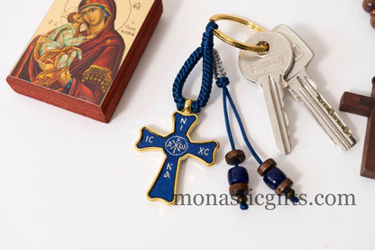 Christian keychain in the shape of a cross , embroidered fabric with the symbols of Jesus Christ in blue color ,a perfect Religious Gift .